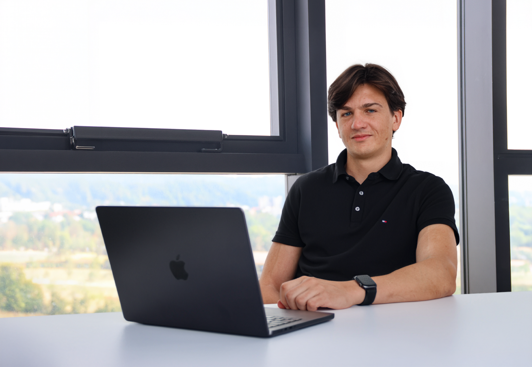 Matic Bernik sitting behind his laptop